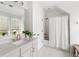 Bright bathroom featuring quartz countertops, gold hardware, and a tub with shower at 3305 Knot Aly, Johns Island, SC 29455
