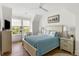 Relaxing bedroom featuring a light blue quilt, wood floors, and lots of natural light at 3305 Knot Aly, Johns Island, SC 29455