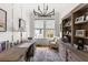Bright home office features custom built-ins, a stylish chandelier, and a large window at 3305 Knot Aly, Johns Island, SC 29455
