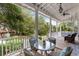Inviting outdoor porch featuring comfortable seating with views of lush gardens and mature trees at 3305 Knot Aly, Johns Island, SC 29455
