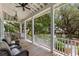 Inviting outdoor porch featuring comfortable seating with views of lush gardens and mature trees at 3305 Knot Aly, Johns Island, SC 29455