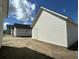Newly built home with white siding, black roof, and a side entrance door on a sunny day at 337 Trailmore Ln, Summerville, SC 29486