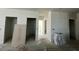 Hallway with rough flooring featuring access to several rooms at 337 Trailmore Ln, Summerville, SC 29486