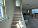 View of unfinished staircase leading to the second floor, bathed in natural light from a nearby window at 337 Trailmore Ln, Summerville, SC 29486