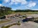 Aerial view of a commercial building with ample parking, set against a backdrop of lush greenery at 342 Saxony Loop, Summerville, SC 29486