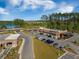 Aerial view of a commercial building with ample parking, surrounded by beautiful landscaping and natural scenery at 342 Saxony Loop, Summerville, SC 29486