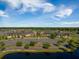 Aerial view of a commercial building with dedicated parking, lush landscaping, and serene natural setting at 342 Saxony Loop, Summerville, SC 29486