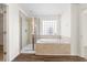 Contemporary bathroom with a shower, soaking tub, and window for natural light at 342 Saxony Loop, Summerville, SC 29486