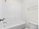 Clean, white bathroom featuring a shower-tub combo and white toilet at 342 Saxony Loop, Summerville, SC 29486