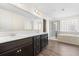 This bathroom offers dual sinks, a soaking tub, and a separate shower stall at 342 Saxony Loop, Summerville, SC 29486