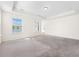 Spacious bedroom with plush carpet and a large window with a view of the pond at 342 Saxony Loop, Summerville, SC 29486