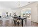 Open concept dining area connected to living room featuring hardwood floors and natural light at 342 Saxony Loop, Summerville, SC 29486