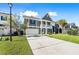 Two-story home with a garage and a long driveway on a sunny day at 342 Saxony Loop, Summerville, SC 29486