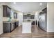 Open kitchen with dark cabinetry, stainless steel appliances, and a functional layout at 342 Saxony Loop, Summerville, SC 29486