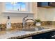 Close up of granite countertops and stainless steel sink in the kitchen at 342 Saxony Loop, Summerville, SC 29486