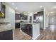 Spacious kitchen featuring dark cabinets, granite countertops, stainless steel appliances, and center island at 342 Saxony Loop, Summerville, SC 29486