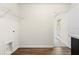This laundry room features wood flooring, a utility sink and a doorway to the exterior at 342 Saxony Loop, Summerville, SC 29486