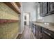 Pantry features open wood shelves and decorative wallpaper at 342 Saxony Loop, Summerville, SC 29486
