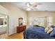 Bedroom featuring a comfortable bed, a dresser with a mirror, and a sunny bay window at 420 Manorwood Ln, Charleston, SC 29414