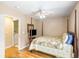 Cozy bedroom with a queen bed, ceiling fan, and doorway to laundry room at 420 Manorwood Ln, Charleston, SC 29414