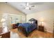 Vaulted-ceiling bedroom with wood floors, desk and chair, and a serene atmosphere at 420 Manorwood Ln, Charleston, SC 29414
