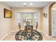 Bright breakfast nook with a glass table, woven chairs, and a bay window at 420 Manorwood Ln, Charleston, SC 29414