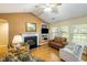 Living room with fireplace, built-in shelving, and a large picture window at 420 Manorwood Ln, Charleston, SC 29414