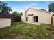 The back of the house features a large back yard, a shed, and two entry doors at 4500 Winterwood Pl, Ladson, SC 29456