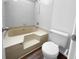 Step up tub with tiled walls and shower head, adjacent to a toilet at 4500 Winterwood Pl, Ladson, SC 29456
