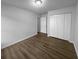 Bright bedroom featuring hardwood floors and a spacious closet for ample storage at 4500 Winterwood Pl, Ladson, SC 29456