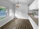 Bright dining area with chandelier and adjacent countertop with sink at 4500 Winterwood Pl, Ladson, SC 29456