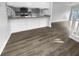 Kitchen with mosaic backsplash, ample counter space, and sightlines to the living area at 4500 Winterwood Pl, Ladson, SC 29456