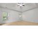 This spacious bedroom offers a ceiling fan, neutral carpet, and an abundance of natural light at 5404 Red Fork Ln, North Charleston, SC 29420