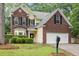 Charming two-story home with brick accents, a two-car garage, and manicured landscaping at 5404 Red Fork Ln, North Charleston, SC 29420