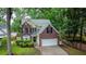 Charming brick and vinyl two-story home with landscaped front yard and attached garage at 5404 Red Fork Ln, North Charleston, SC 29420