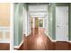 Bright foyer with French doors, hardwood floors, and an open view to the dining area at 5404 Red Fork Ln, North Charleston, SC 29420
