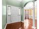 Inviting entryway features hardwood floors and a classic archway leading to another room at 5404 Red Fork Ln, North Charleston, SC 29420