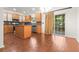 Bright eat-in kitchen with wood cabinets, stainless steel appliances, and sliding glass doors at 5404 Red Fork Ln, North Charleston, SC 29420