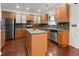 Well-equipped kitchen with wood cabinets, stainless steel appliances, and a center island at 5404 Red Fork Ln, North Charleston, SC 29420
