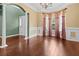 Spacious living area showcasing hardwood floors, columns, and a glimpse of the foyer at 5404 Red Fork Ln, North Charleston, SC 29420