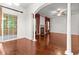 Bright living room with fireplace, hardwood floors, and a view to the outdoor patio at 5404 Red Fork Ln, North Charleston, SC 29420