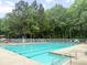 Large community pool offers a refreshing outdoor space with plenty of lounge chairs at 5404 Red Fork Ln, North Charleston, SC 29420