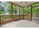 Outdoor space featuring a spacious screened porch overlooking a wooded area at 5404 Red Fork Ln, North Charleston, SC 29420