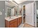 An additional full bathroom featuring a double sink vanity and an open doorway leading to a walk-in closet at 541 Brick Barn Ln, Goose Creek, SC 29445