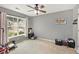 A secondary bedroom featuring a ceiling fan, a large window, and neutral walls at 541 Brick Barn Ln, Goose Creek, SC 29445