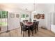 Bright dining room features a sliding glass door, modern lighting and wood-look floors at 541 Brick Barn Ln, Goose Creek, SC 29445