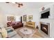 Open-concept living room boasts a fireplace and access to other living areas at 541 Brick Barn Ln, Goose Creek, SC 29445