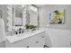 Elegant bathroom featuring a double vanity with framed mirrors and stylish fixtures adding to the modern design at 718 Parish Rd, Charleston, SC 29407