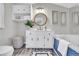 Bathroom featuring a tub, decorative mirror and stylish decor at 718 Parish Rd, Charleston, SC 29407