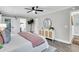 Comfortable bedroom featuring a ceiling fan, a stylish dresser, and access to an ensuite bathroom at 718 Parish Rd, Charleston, SC 29407